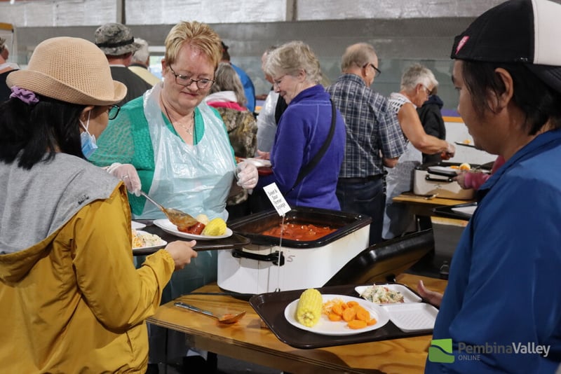 People enjoying the buffet supper.